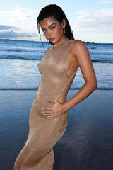 Eloura – Shimmer maxi dress with open back and minimalist cut