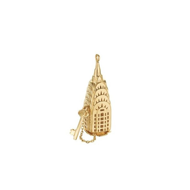 Gold charm of the top of the Chrysler Building with hinged bottom and gold key attached by chain. 'NYC' is inscribed on bow of key.