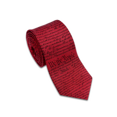A red silk tie with the printed text of the US Constitution in a dark red font.